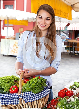 Young woman buying fruits and vegetables