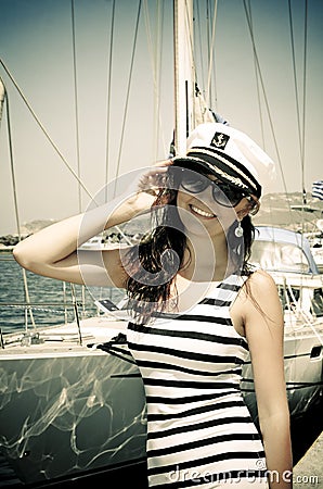 Young woman in captain cap