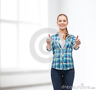 Young woman in casual clothes showing thumbs up