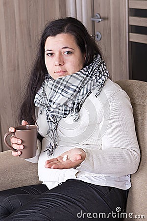 Young woman with cold at home