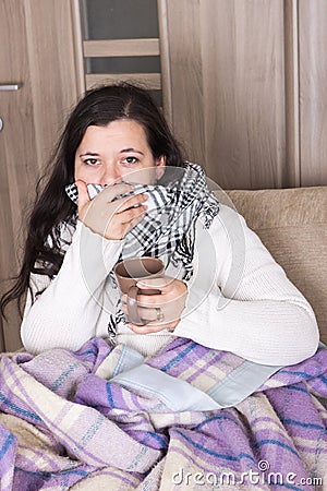 Young woman with cold at home