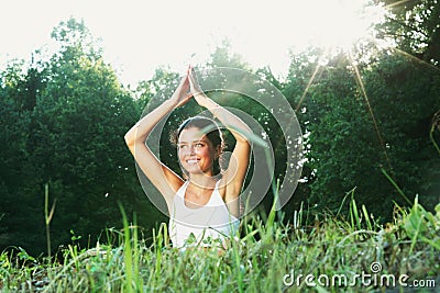 Young woman doing yoga exercise