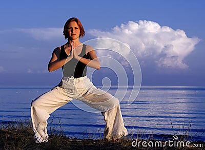 Young woman doing yoga outside