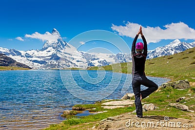 Young woman doing a yoga pose for balance and stretching