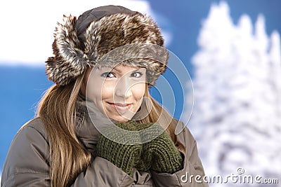 Young woman dressed up warm freezing smiling