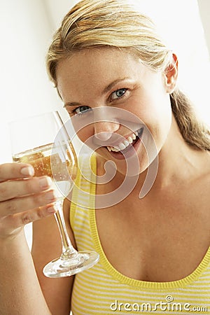 Young Woman Drinking A Glass Of Wine