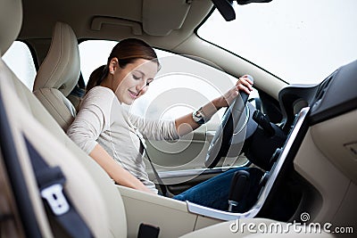 Young, woman driving a car