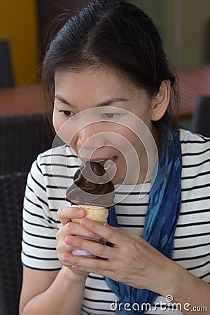 Young woman eating ice cream