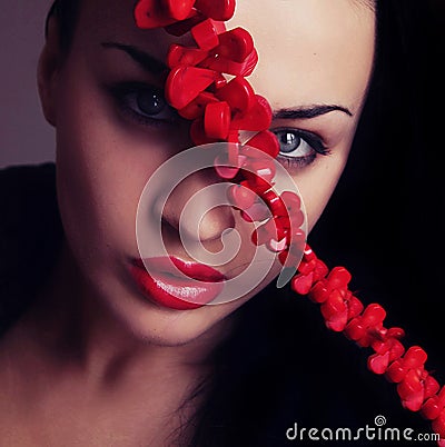 Young woman face with red lips and cross belt