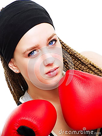 Young woman fighter with boxing gloves over white