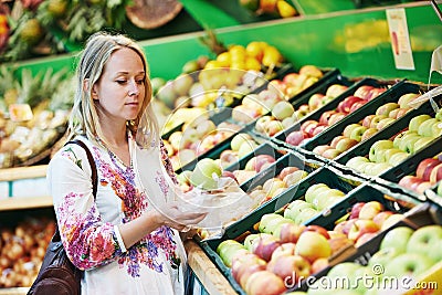 Young woman at food shopping in supermarket