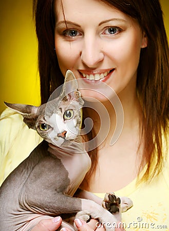 Young woman with fun sphynx cat
