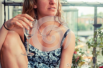 Young woman with glass of wine