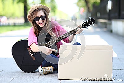 Young woman with a guitar