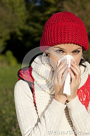 Young woman with handkerchief and flu