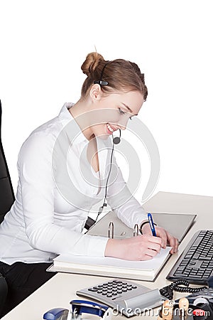 Young woman with headset is writing to file