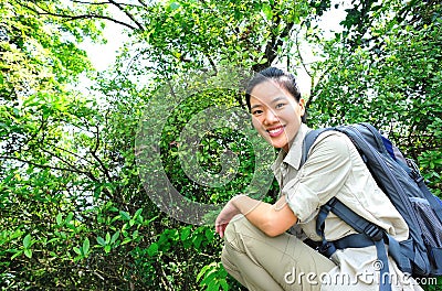 Young woman hiker in tropical jungle