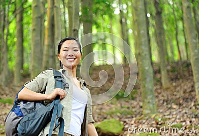 Young woman hiker in tropical jungle