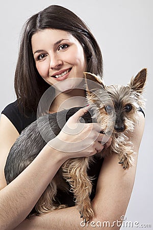 Young woman holding dog