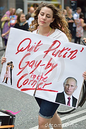 Young woman holding sign against president putins law on gay rights