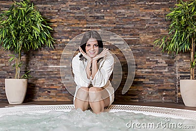 Young woman in the hot tub