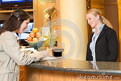 Young woman at the hotel reception