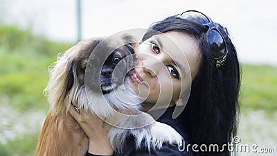 Young woman hugging her dog friend