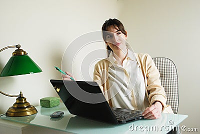 Young Woman with Laptop Computer Contemplating