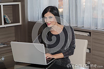 Young woman with laptop in the room