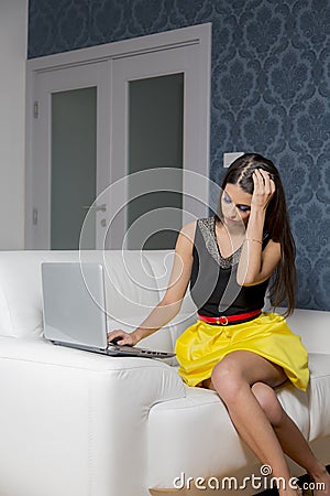 Young woman with laptop in the room