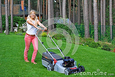 Young woman mowing grass