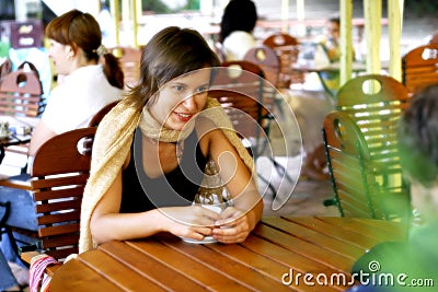 Young woman at outdoor coffee shop