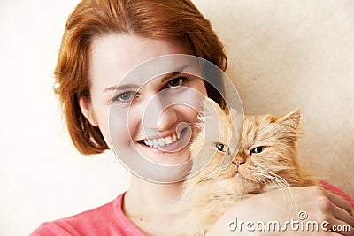 Young woman with Persian cat