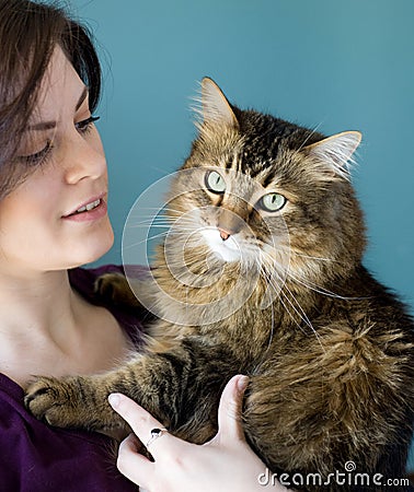 Young woman with pet cat