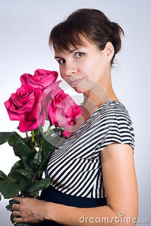 Young woman with pink roses