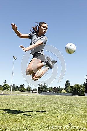 Young woman playing soccer