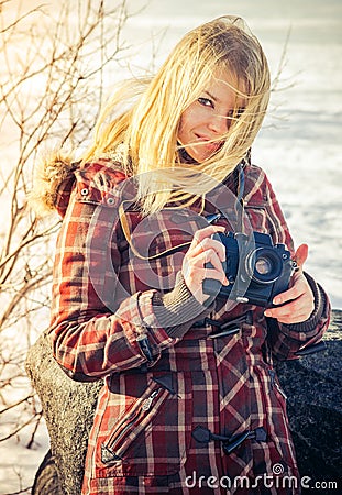Young Woman with retro photo camera outdoor