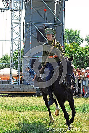 A young woman rides a horse. Horse riders competition