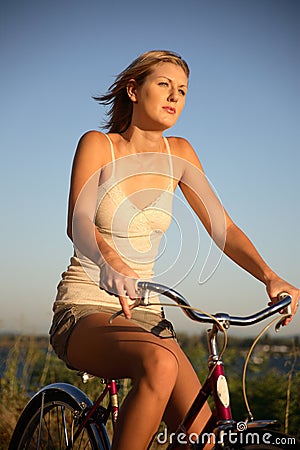 Young woman riding bike