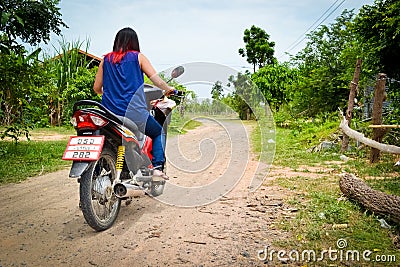 Young woman riding a motorcycle