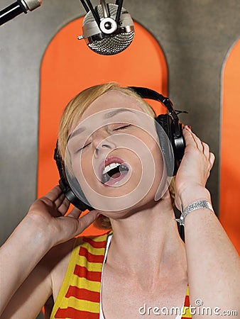 Young Woman Singing In Studio