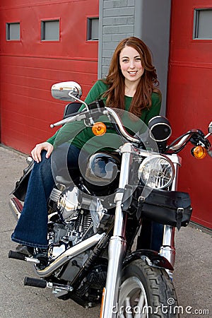 Young Woman Sitting on Motorcycle