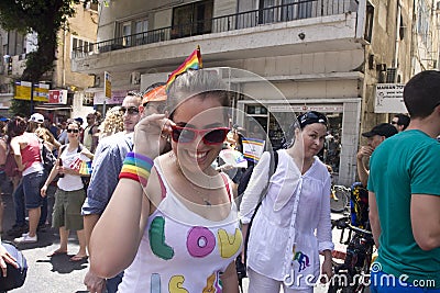 Young woman smiling at the camera at Pride Parade