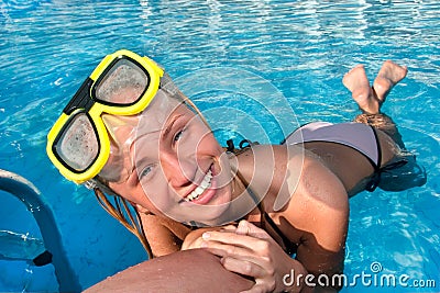 Young woman in the swimming pool