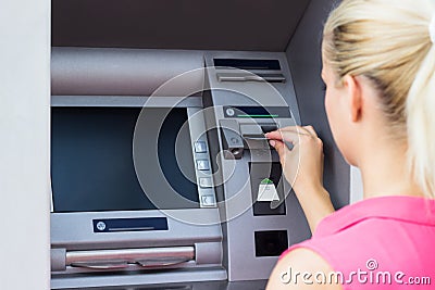 Young woman using credit card