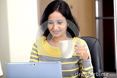 Young woman using tablet computer