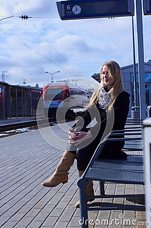 Young woman waiting train