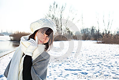Young woman in warm clothes outdoor in a winter day