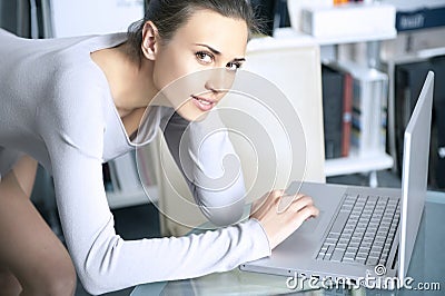 Young women works on a laptop