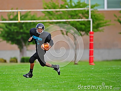 Youth American Football Running back going for it